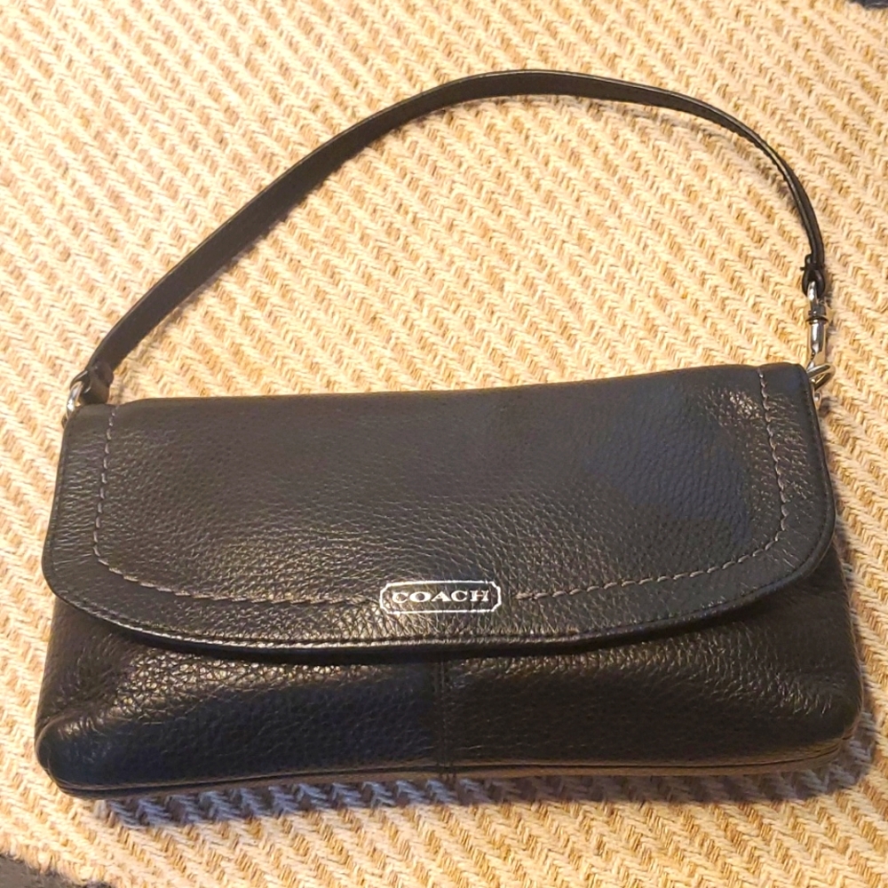 Coach wristlet black and silver.‎